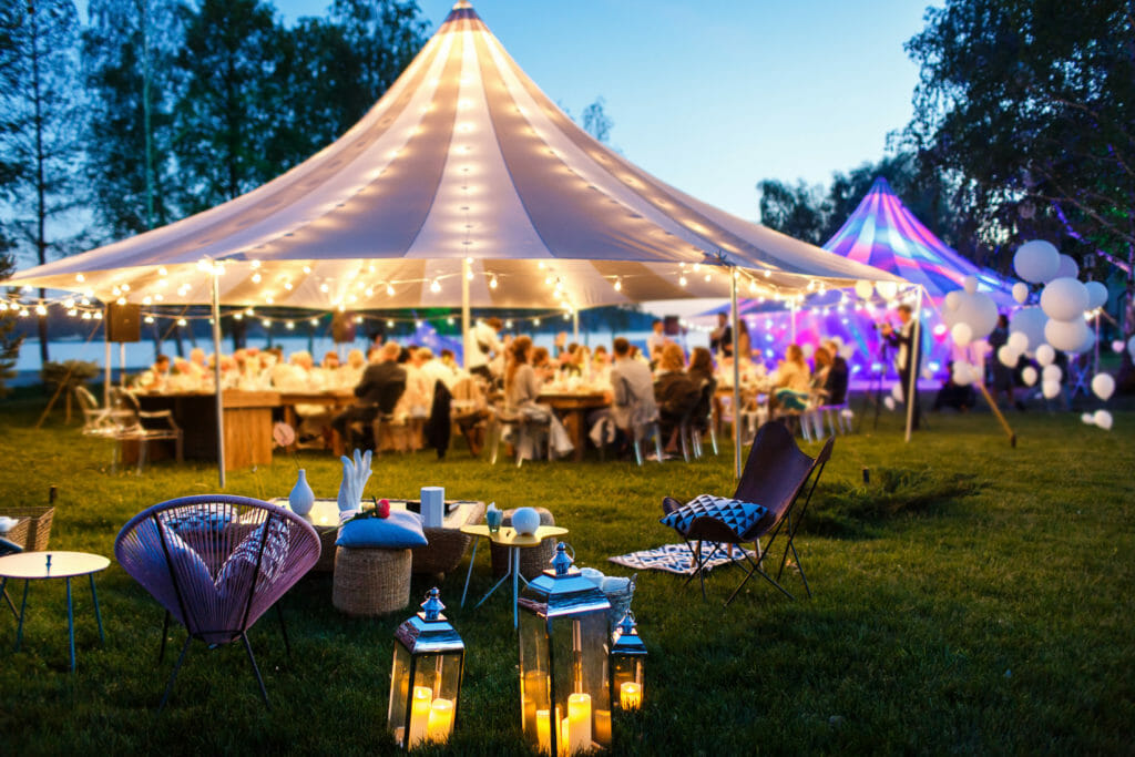 Colorful wedding tents at night.
