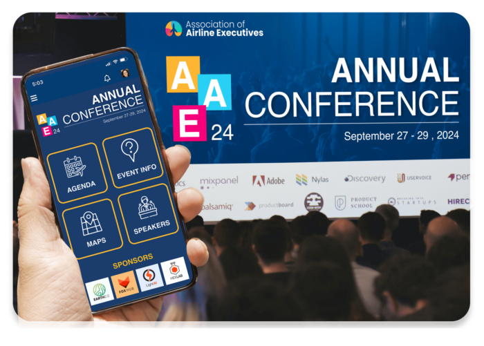 Mobile phone with event app held up with crowd viewing matching live display on conference screen